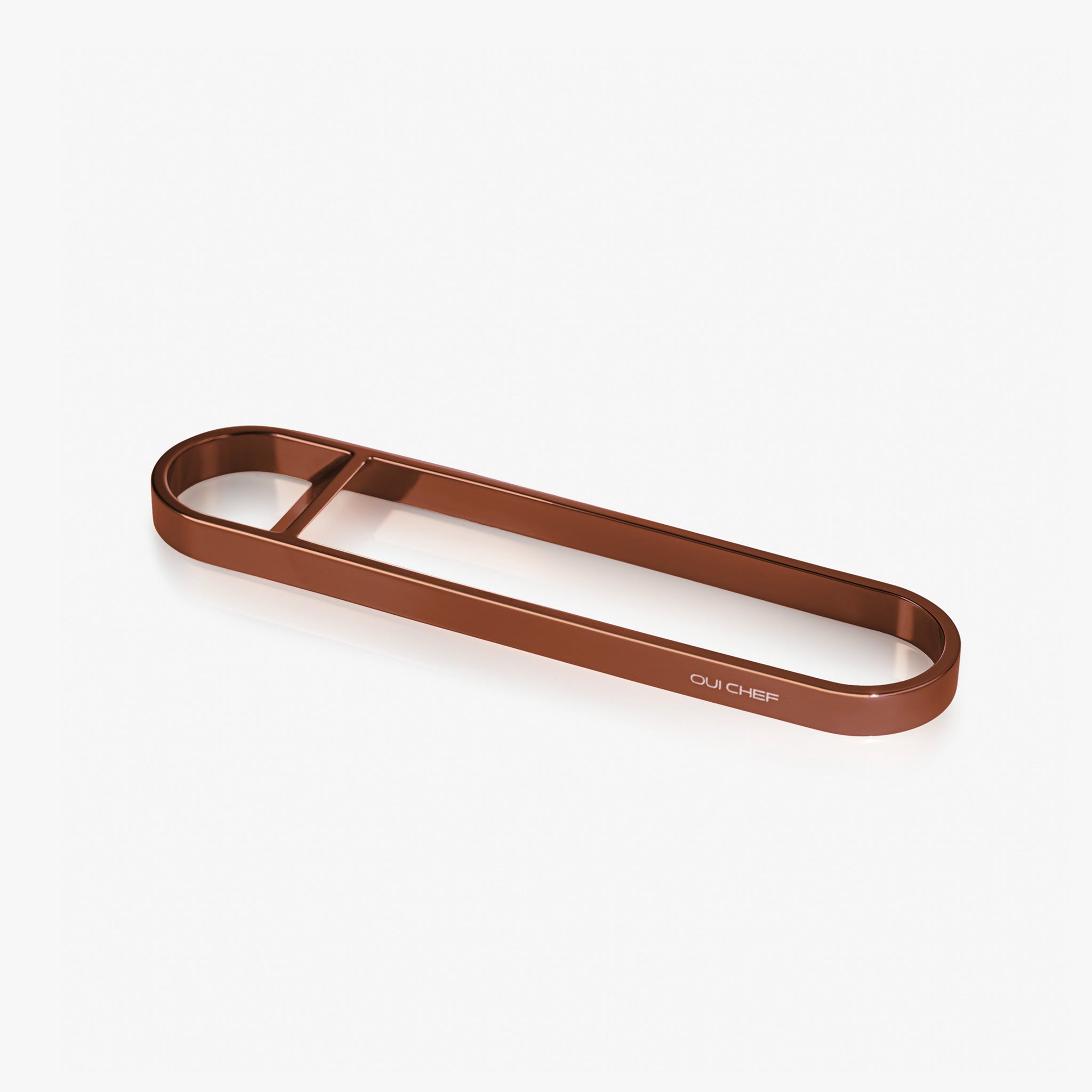 Copper stainless steel bottle opener sitting against a white background with "oui chef" engraved on the side.